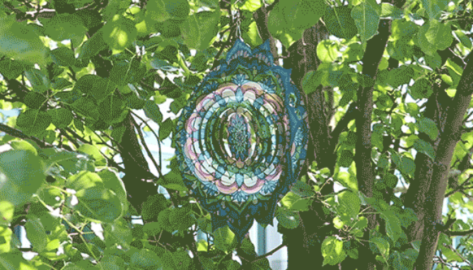 Add color and motion to any garden with this artistic designed, laser-cut spinning art. Spread the vanes out to catch the wind and watch the decorative Mandala Flower spin, creating a captivating 3D display.