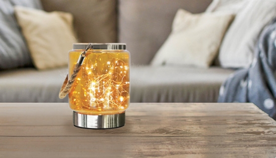 This jar is made out of an elegant, copper colored glass and it houses 20 LED fairy lights. Each little light sparkles and bounces off the glass to give off a warm glowing light effect.