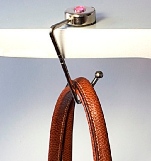 With the Purse Hook you NEVER have to worry about this! Simply hang your Purse Hook on the edge of the table and hang your purse on the hook. This holds your purse within &quot;YOUR&quot; easy reach, not the person sitting at the table behind you!
