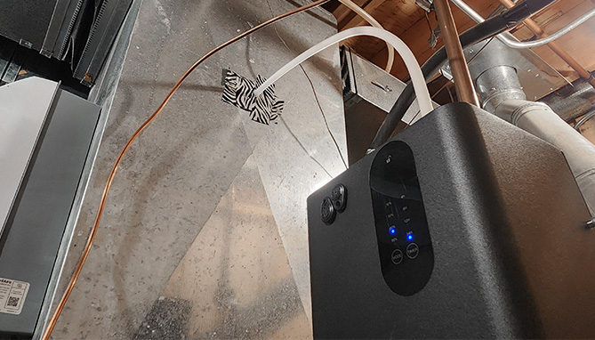 image of whole house waterless diffuser unit easily installed next to indoor HVAC unit